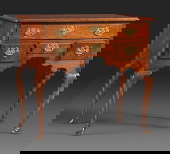 A Queen Anne Carved and Figured Walnut Dressing Table: A Queen Anne Carved and Figured Walnut Dressing Table Mid-Atlantic States, Circa 1760 the backboards of each drawer numbered 21, 22, 23, 24, the hardware, while seemingly of the period, is replaced. H