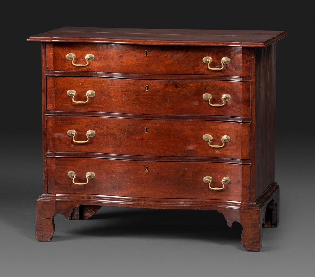 A Chippendale Mahogany Serpentine Chest of Drawers: A Chippendale Mahogany Serpentine Chest of Drawers Late 18th Century drawer pulls are replaced. Height 31 1/2 x width 36 3/4 x 20 3/4 inches. This lot is located in Cincinnati.