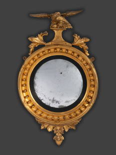 A Federal Giltwood Bull's Eye Mirror: A Federal Giltwood Bull's Eye Mirror 19th Century Height 30 1/2 x width 18 x depth 4 3/4 inches. This lot is located in Cincinnati. Provenance: Purchased from William C. Adams Antiques, Richmond, Virg