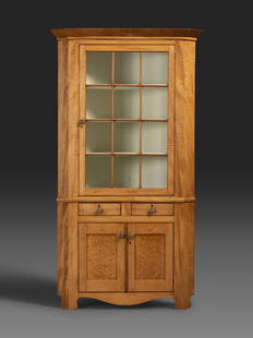 A Country Federal Bird’s Eye and Tiger Maple Corner Cupboard: A Country Federal Bird’s Eye and Tiger Maple Corner Cupboard 19th Century in two parts, appears to retain the original glass. Height 74 1/4 x width 46 1/4 x depth 25 inches. This lot is located