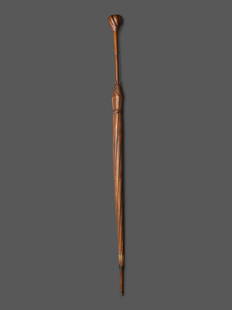 A Folk Art Carved Wood Umbrella Form Cane: A Folk Art Carved Wood Umbrella Form Cane Early 20th Century Length 34 1/2 inches. This lot is located in Cincinnati. Property from the Estate of Barbara B. Elliott