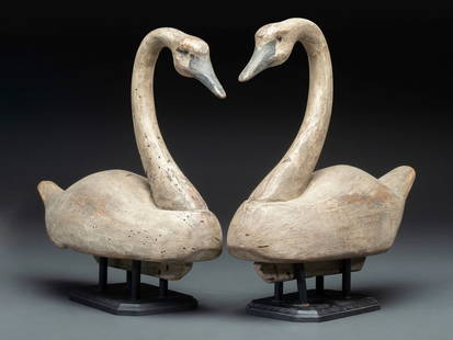A Pair of Painted Wood Swan Decoys: A Pair of Painted Wood Swan Decoys 20th Century both stamped KLR, to underside. Height 18 x length 22 inches. This lot is located in Cincinnati.