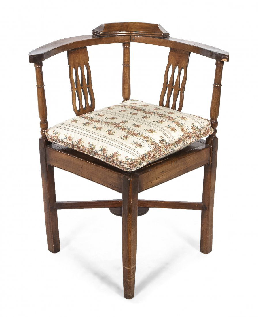 A Continental Fruitwood Corner Chair, Height 31 i: A Continental Fruitwood Corner Chair, having a curved crest rail over the vertical pierced splats, raised on square legs joined by an X-form stretcher. Height 31 inches. Property from the Collection o