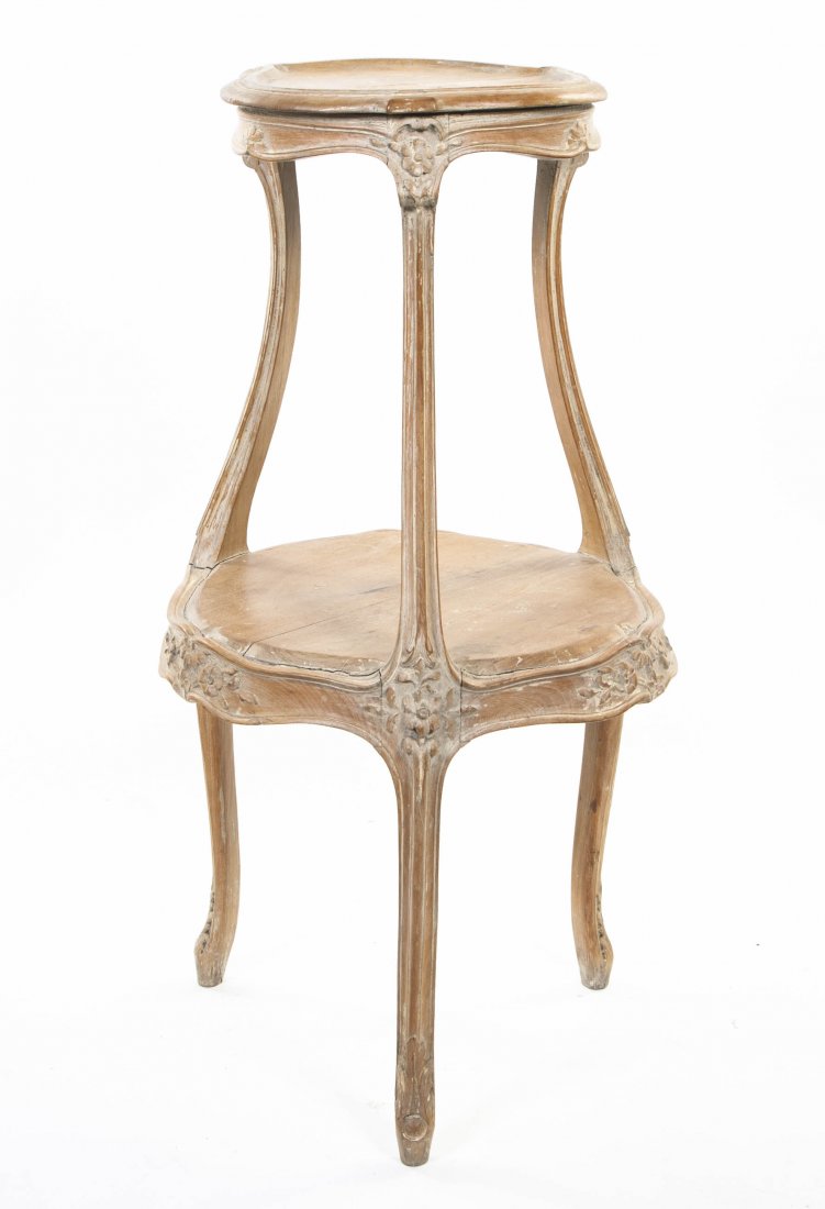 A Louis XV Style Pedestal Table, Height 37 inches: A Louis XV Style Pedestal Table, having two circular tiers, with carved foliate decoration, raised on three cabriole legs. Height 37 inches. Property from the Estate of Jane Z. Plimpton, Chicago, Illi