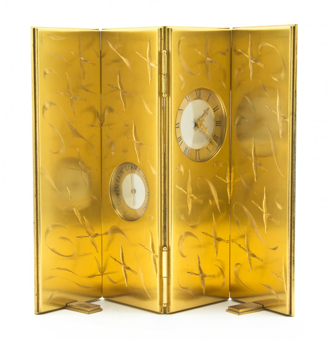 A Three-Panel Bronze Desk Clock and Barometer, He: A Three-Panel Bronze Desk Clock and Barometer, Heure Laverne, Paris, etched throughout with birds in flight. Height 8 3/4 inches. Property from the Lucie Sable Sandler Trust, Lincolnwood, Illinois