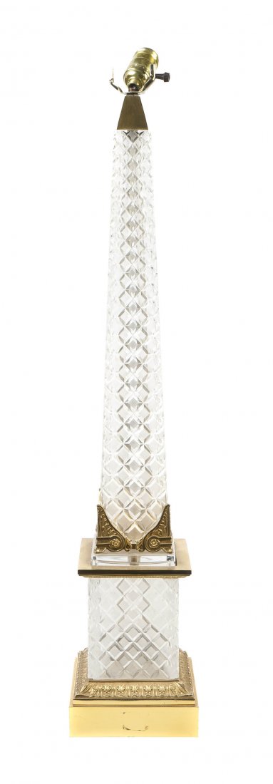 A French Cut Glass and Brass Table Lamp, Height o: A French Cut Glass and Brass Table Lamp, of obelisk form. Height overall 43 inches. Property from the Lucie Sable Sandler Trust, Lincolnwood, Illinois