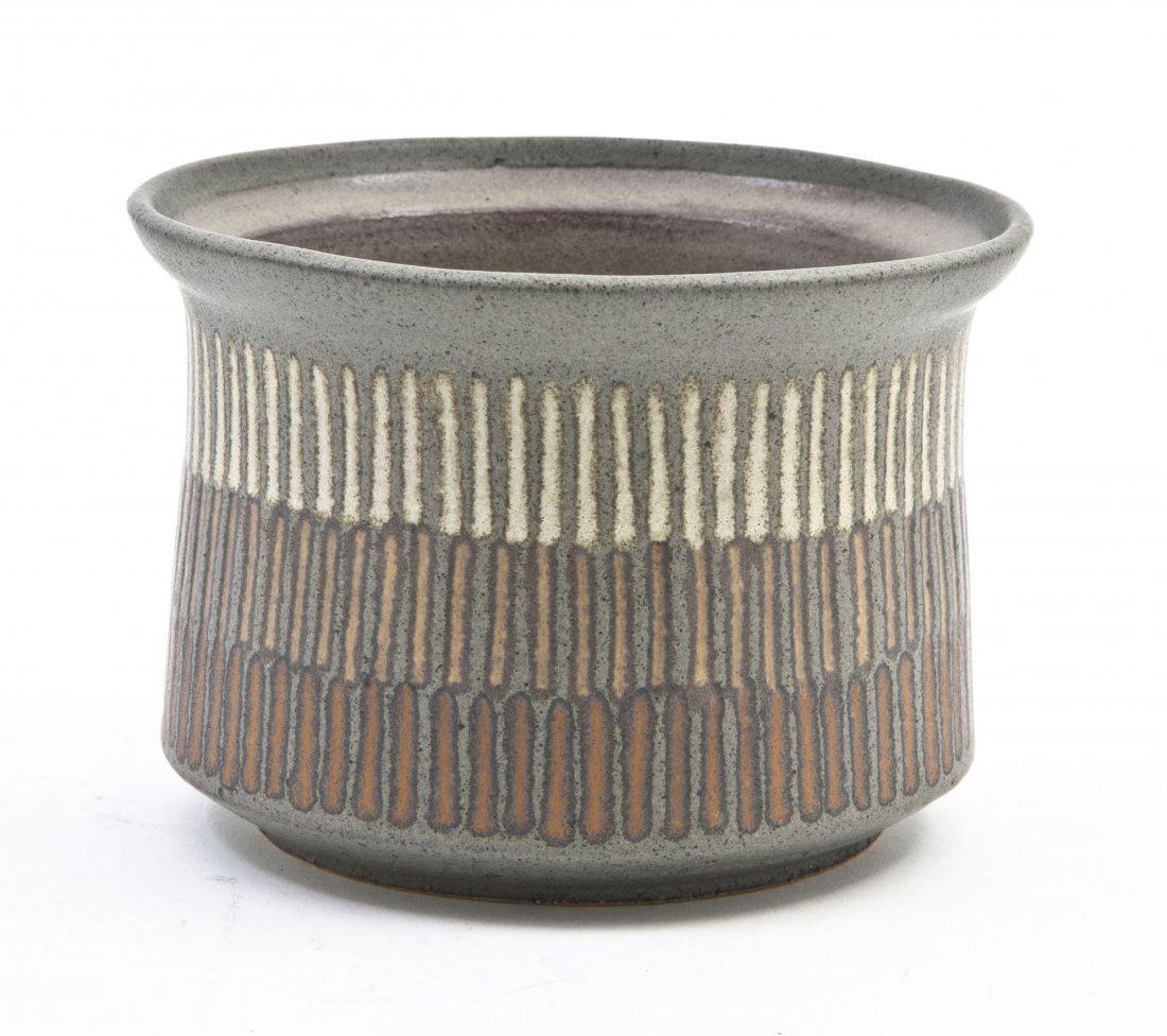 A Stoneware Bowl, Clyde Burt, Height 4 x diameter: A Stoneware Bowl, Clyde Burt, having three rows of carved concentric lines in red, orange and white, incised "CB" to the base. Height 4 x diameter 5 3/8 inches.