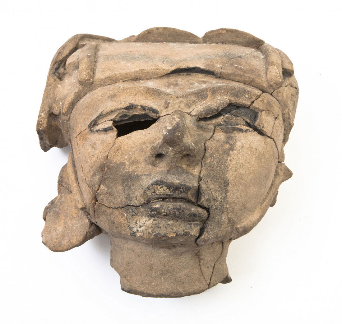 An Olmec Style Pottery Mask, Height 7 1/4 inches.: An Olmec Style Pottery Mask, with helmet, previously broken and repaired. Height 7 1/4 inches. Property from the Estate of Edward F. Donohue, Grosse Pointe, Michigan