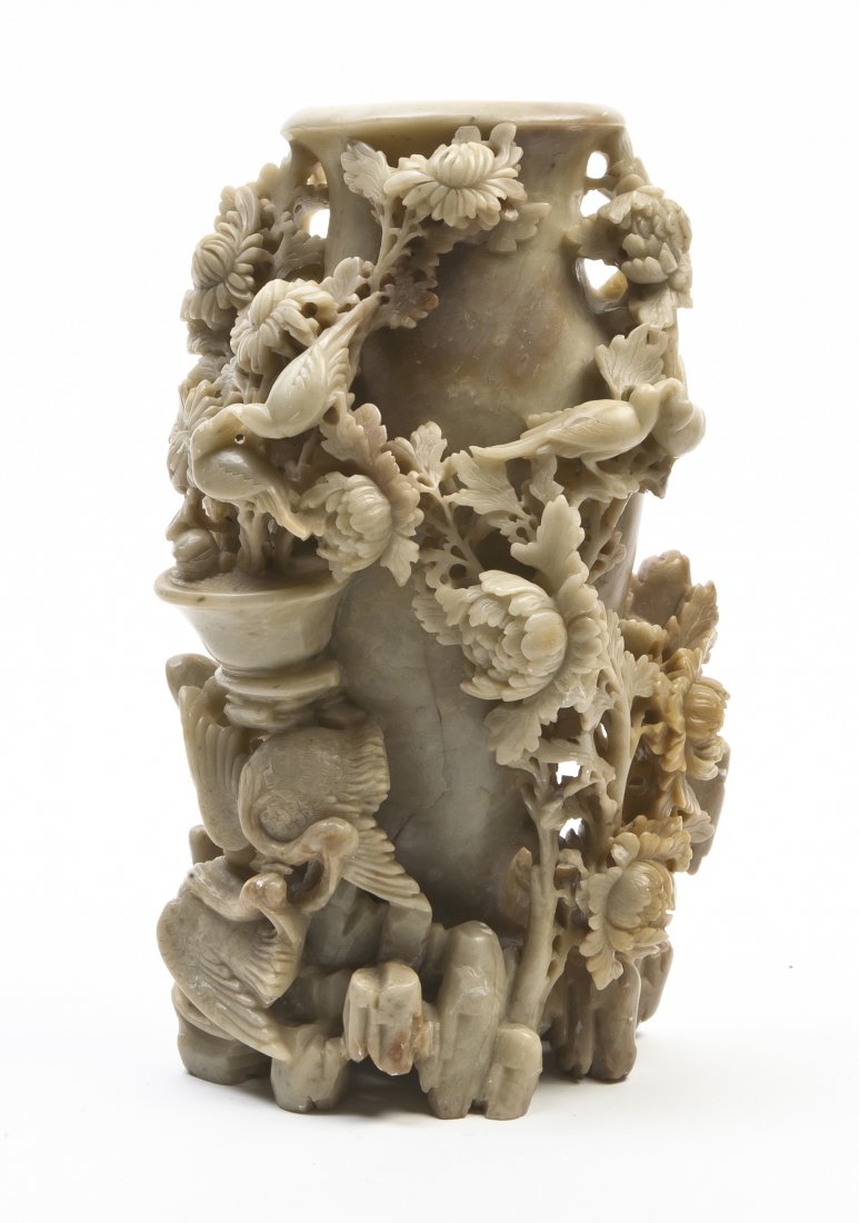 A Chinese Carved Soapstone Vase, Height 9 3/4 inc: A Chinese Carved Soapstone Vase, of olive green colored stone, having a central vase surrounded by pierced carving of birds amongst flowering chrysanthemums raised above a rock work base. Height 9 3/4