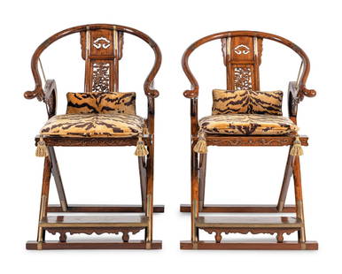 A Pair of Chinese Brass Mounted Hardwood Horseshoe-Back Campaign Chairs: A Pair of Chinese Brass Mounted Hardwood Horseshoe-Back Campaign Chairs 20th Century Height 41 x width 25 x depth 30 inches. This lot is located in Chicago.