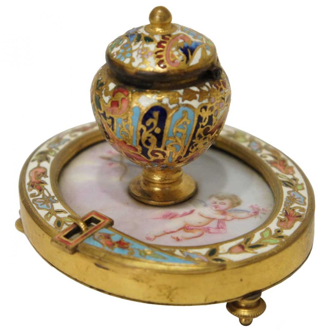 A French Gilt Bronze, Porcelain & Champlevé Encrie: A French Gilt Bronze, Porcelain & Champlevé Encrier, circa 1880, mounted with a hinged, domed lid with ball finial on a round base, inset with a Limoges plaque depicting a cupid; the bronze base is r