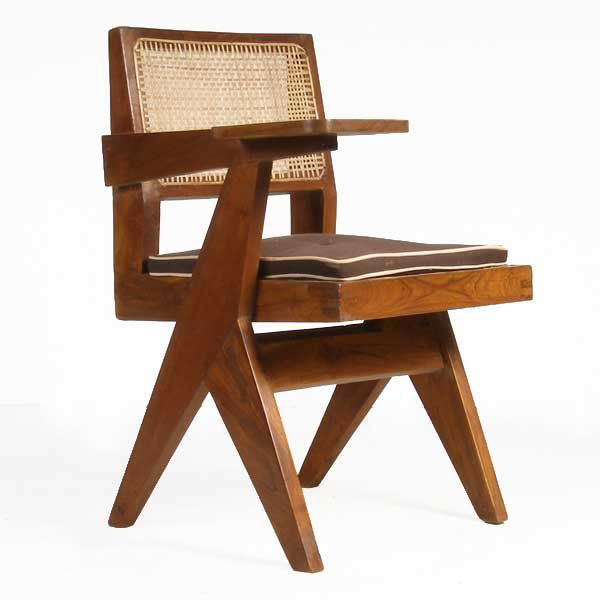 A Teak Class Chair, Pierre Jeanneret, Height: A Teak Class Chair, Pierre Jeanneret, circa 1952-56, having a low, caned backrest and seat, a tablet desk arm and raised on scissor legs joined by a double stretcher. Height 32 x width 22 x depth 24 i