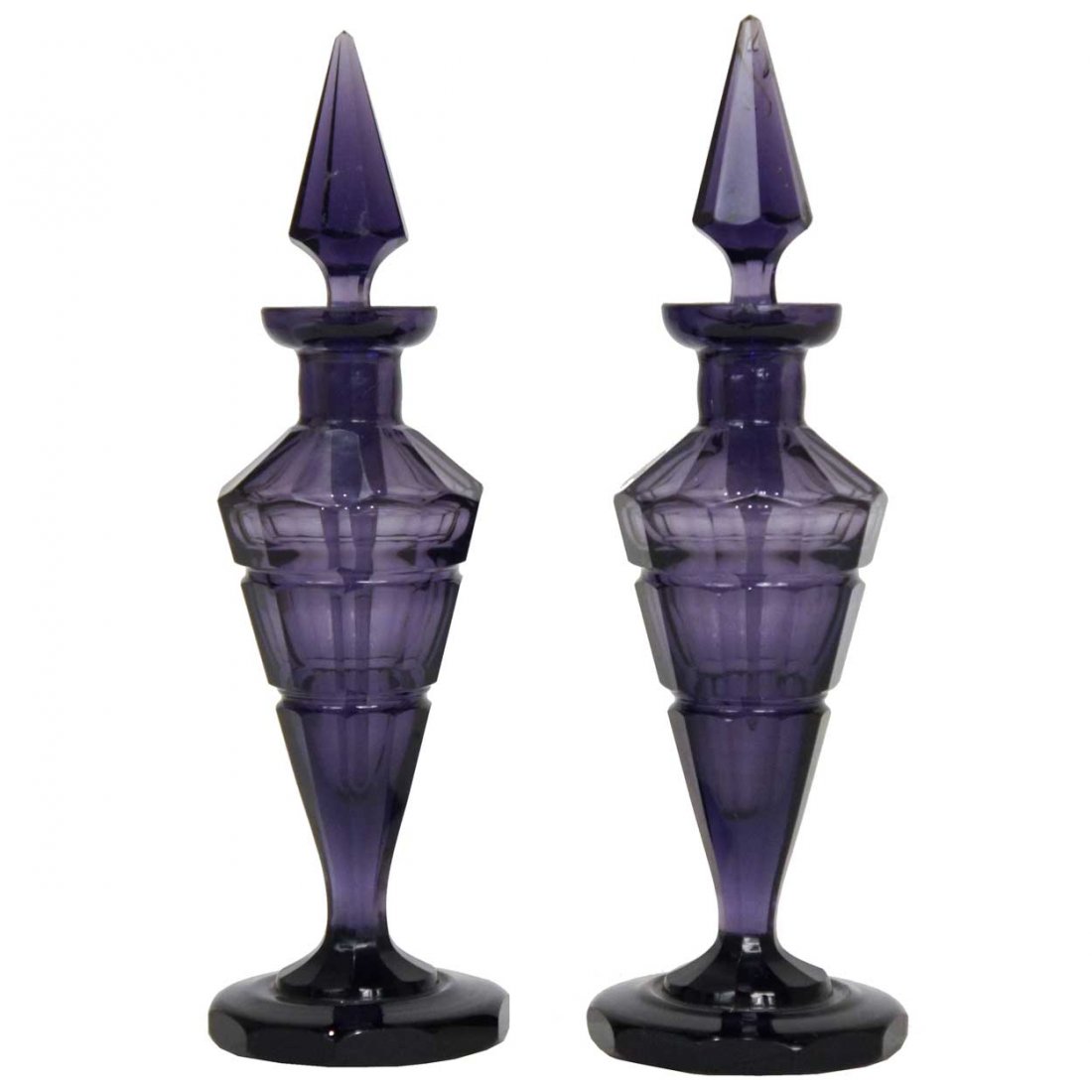 A Pair of Bohemian Amethyst Faceted Glass Perfume: A Pair of Bohemian Amethyst Faceted Glass Perfume Bottles, circa 1900, each with a obelisk stopper on a faceted, trumpet body and round foot. Height 9 x width 2 3/4 x depth 2 3/4 inches.