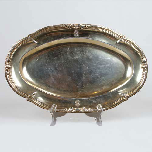 A French Gilt Silver Oval Shaped Platter, Gustave: A French Gilt Silver Oval Shaped Platter, Gustave Keller, circa 1900, traditionally crafted in sterling silver with a vermeil wash with a triple reeded, shaped edge with foliate details and two owner'