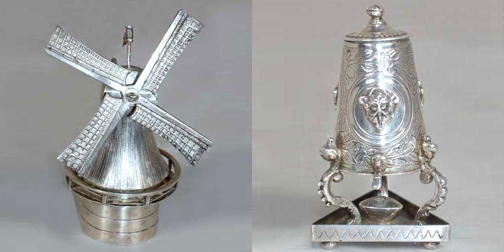 Two Dutch Silver Articles, Height of first 3 x wid: Two Dutch Silver Articles, 19th century, comprising a windmill with a flag post with a domed lid with a four sail blade and wheel mechanism attached to a lever and a Zwanenburg miniature coffee urn on