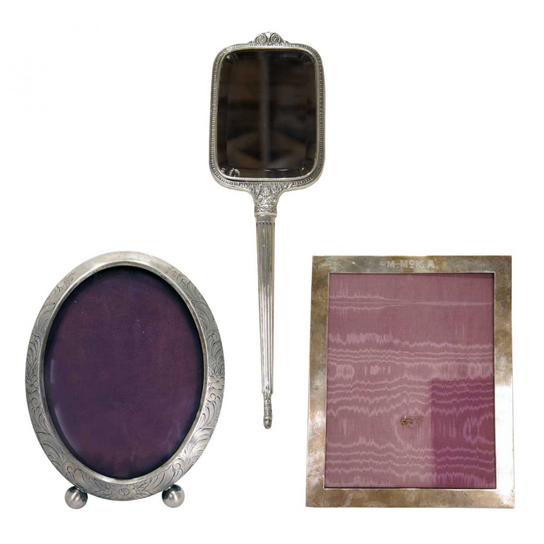 A Collection of three American Silver articles, He: A Collection of three American Silver articles, Comprising of a Mauser Mfg. Co. sterling silver frame, an International Silver Co. sterling silver hand mirror, and a silver oval photograph frame. <