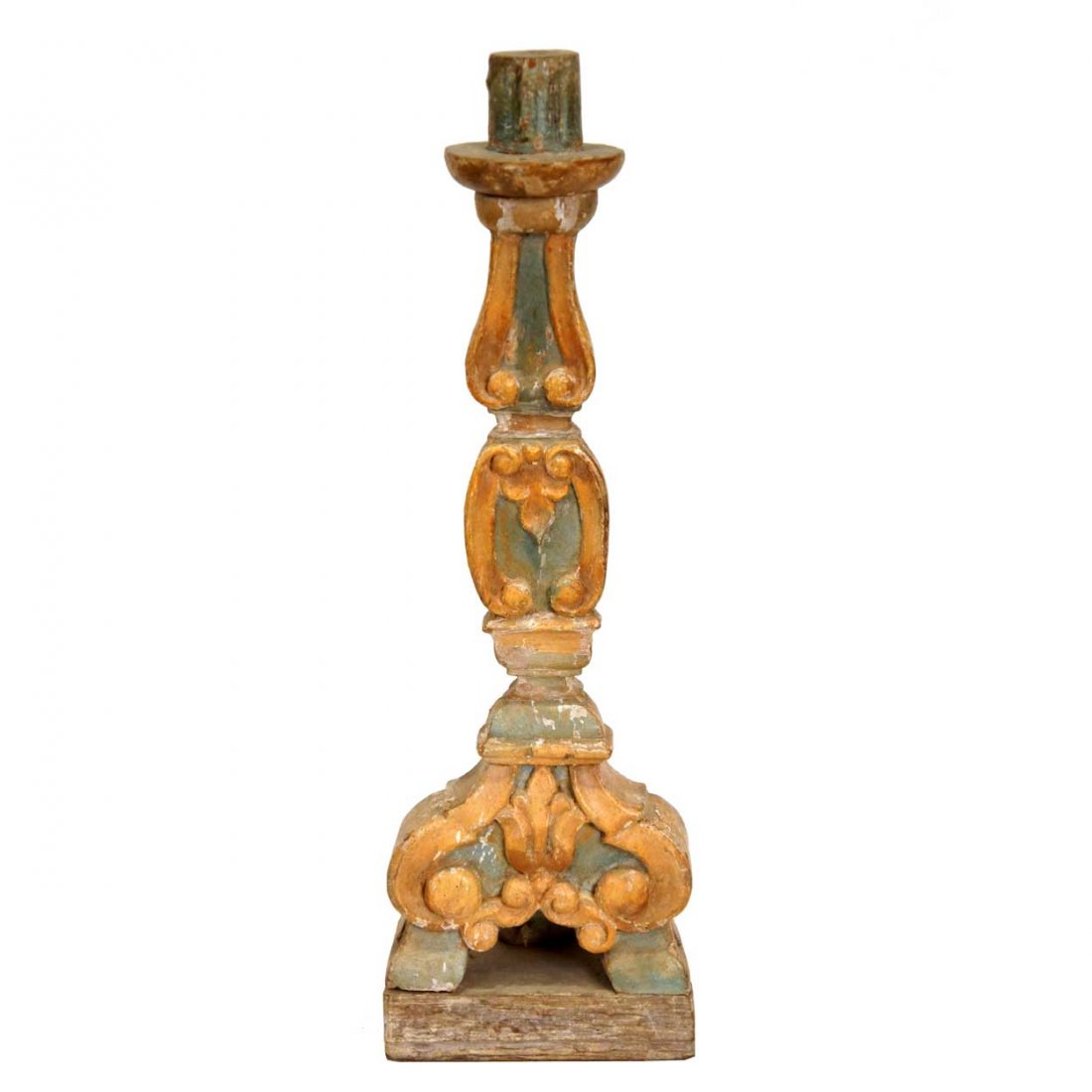 An Indo-Portuguese Baroque Painted Teak Candlestic: An Indo-Portuguese Baroque Painted Teak Candlestick, 18th century, having wide channelled scrolls and original blue and ochre painted finish, the baluster stem is raised on a tripartite footed base an