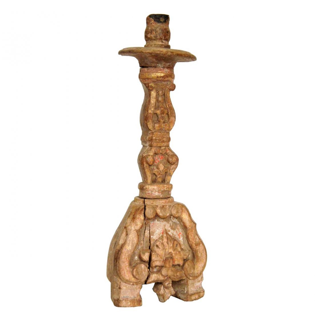 An Indo-Portuguese Baroque Painted Teak Candlestic: An Indo-Portuguese Baroque Painted Teak Candlestick, 18th century, having wide channelled scrolls, carved with a round drip pan on a baluster stem and tripartite footed base, retains partial painted f