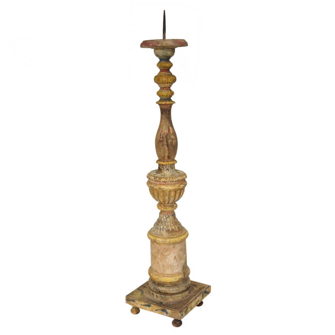 An Indo-Portuguese Painted Teak Candlestick, Heigh: An Indo-Portuguese Painted Teak Candlestick, having a broad drip pan that surmounts a baluster-turned stem, with a central, reeded urn, that rests atop a square base on small feet. Height 29 x width 6