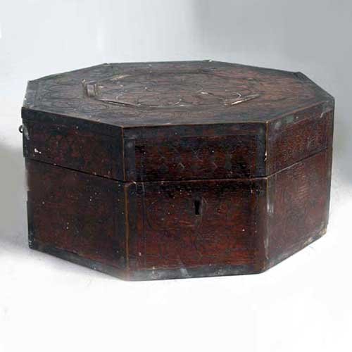 An Anglo Indian Tarkashi Brass and Teak Octagonal : An Anglo Indian Tarkashi Brass and Teak Octagonal Box, circa 1860, of octagonal form with brass strapping, escutcheon and side handles; the hinged lid is inlaid with brass wire inlay in a rosette and 