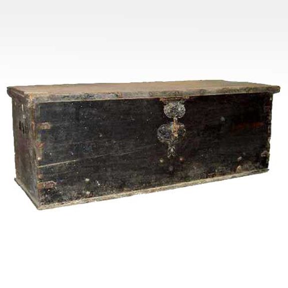 A Portuguese Iron Mounted Pine Coffer Trunk, Heigh: A Portuguese Iron Mounted Pine Coffer Trunk, 18th century, of rectangular form with overhanging lid, on a iron strapped base with carrying handles and large iron escutcheon. Height 22 x width 59 x dep