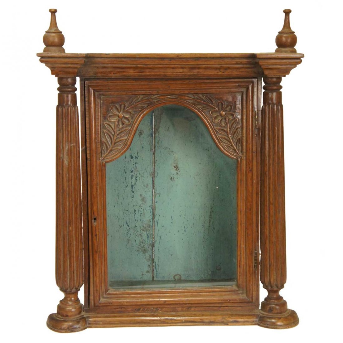An Indo-Portuguese Painted Jackfruit Tabletop Shri: An Indo-Portuguese Painted Jackfruit Tabletop Shrine Cabinet, circa, 1860, having a molded cornice supporting two turned finials, and surmounting a glazed door with arched pane and hand carved details