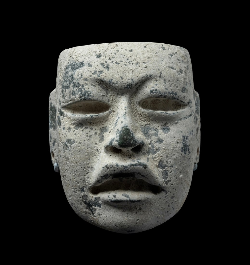 An Olmec Jade and Stucco Mask: An Olmec Jade and Stucco MaskCirca 1100-500 B.C.Height 4 7/8 inches (12.38 cm).Property from a New York Collection Provenance: Javier L. Balderas Collection, New York, 2010. [accompanied with a labora