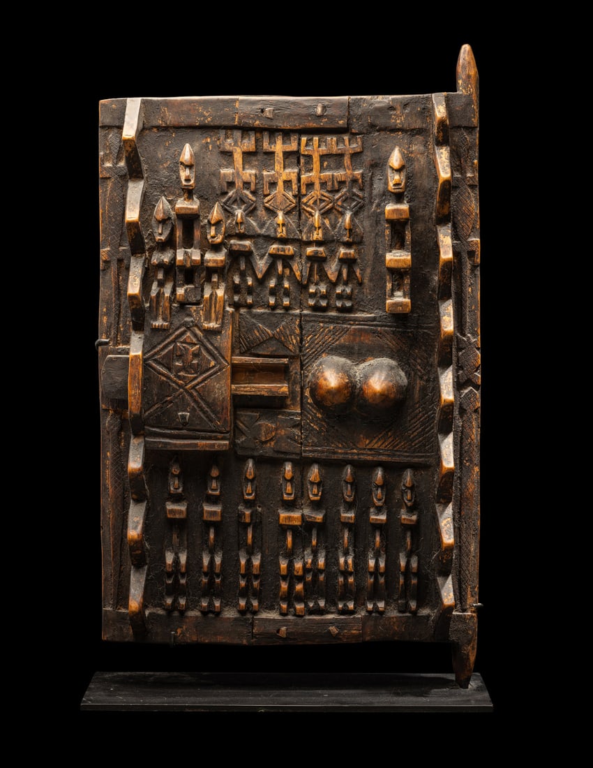 A Dogon Wood Door: A Dogon Wood DoorWest Africa, MaliHeight 24 1/4 inches (61.6 cm).Property from the Estate of Charles S. Hopper, Chicago, Illinois Provenance: Charles Hopper (1949-2012), Chicago, Illinois, acquired 19