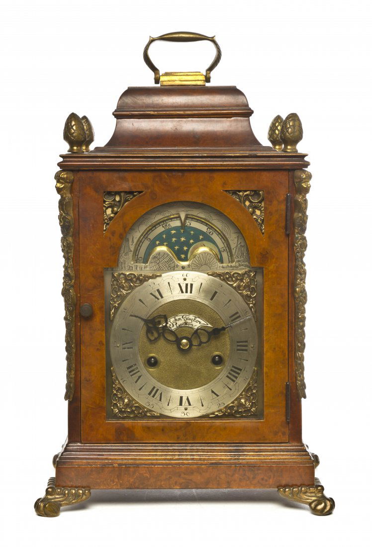 A Burlwood and Gilt Metal Bracket Clock, John Taylo: A Burlwood and Gilt Metal Bracket Clock, John Taylor, works London, case Hollard, the face with a moon phase dial and steel chapter ring, having Roman hours and Arabic minutes. Height 16 inches.