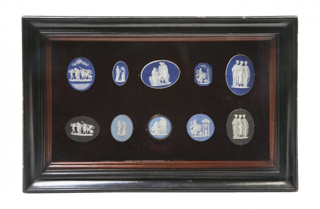 A Collection of Ten Wedgwood Jasperware Medallion: A Collection of Ten Wedgwood Jasperware Medallions, each depicting classical figures, set in a velvet-lined wood frame. Height of tallest 2 1/4 inches.