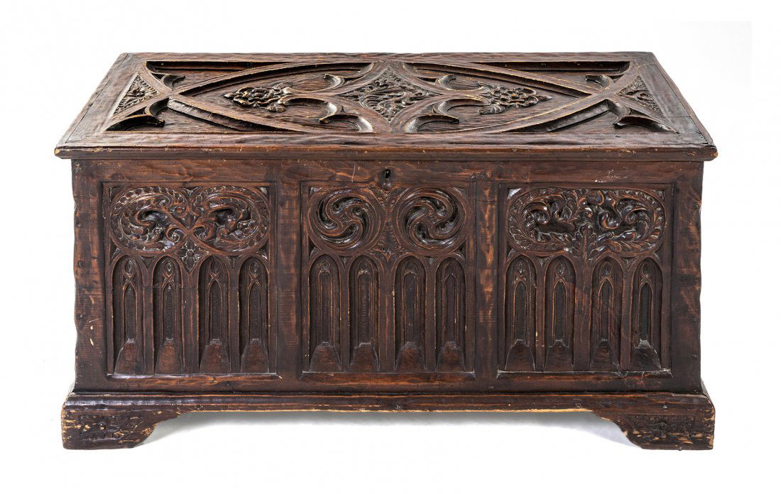 An English Oak Chest, later carved by Charles S. H: An English Oak Chest, later carved by Charles S. Hall, 18th century and later, having a rectangular top over the conforming case, carved with gothic motifs throughout, impressed brand Hand carved by C