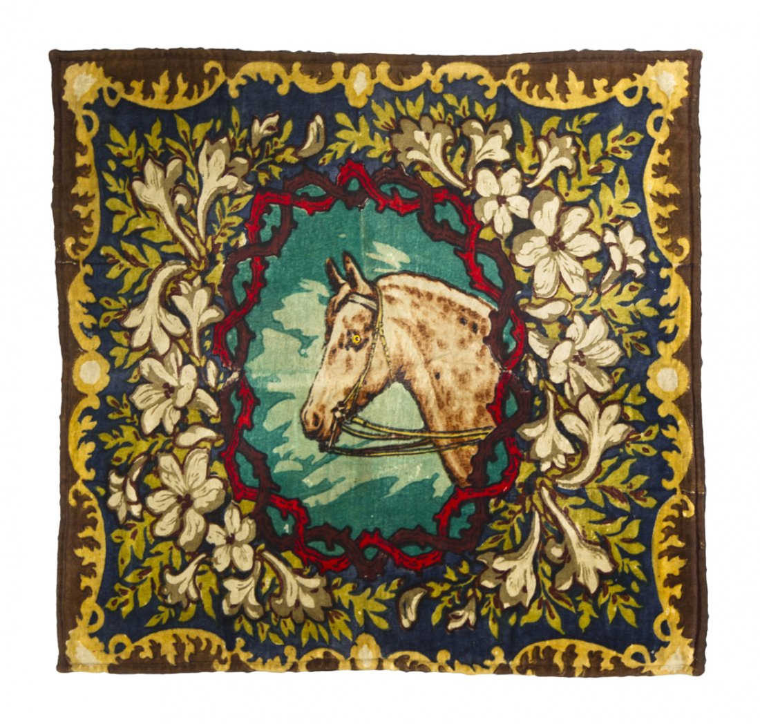 A Chase Glass-Eyed Horse Pattern Carriage Blanket,: A Chase Glass-Eyed Horse Pattern Carriage Blanket, having a central image of a horse surrounded by an intertwining cartouche with floral borders on a blue and brown field. 4 feet 9 3/8 inches x 4 feet