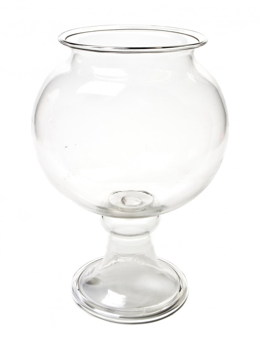 An American Blown Glass Fish Bowl, Height 15 1/4 i: An American Blown Glass Fish Bowl, third quarter 19th century, having a spherical bowl over the flared circular foot. Height 15 1/4 inches. Property from the Estate of William P. Tarzwell, Elgin, Illi