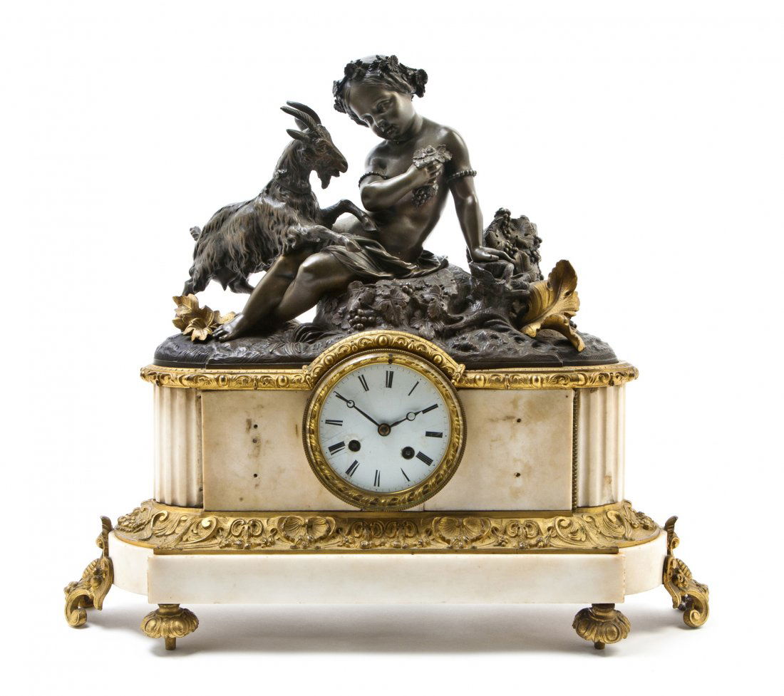 A Continental Bronze and Marble Mantel Clock, Widt: A Continental Bronze and Marble Mantel Clock, depicting a young girl with a playful goat above the circular enameled dial with Roman hours over a shaped plinth base, raised on toupie feet, having Roll