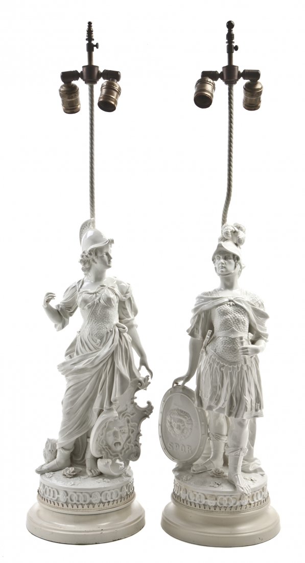 A Pair of Continental Blanc de Chine Porcelain Fig: A Pair of Continental Blanc de Chine Porcelain Figures, likely Nymphenburg, each depicting a warrior in armor with shield, mounted as lamps. Height 19 inches. Property from the Estate of Helen Mouzake
