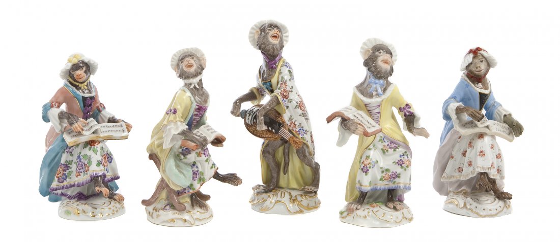 A Meissen Porcelain Five-Piece Monkey Band, Height: A Meissen Porcelain Five-Piece Monkey Band, comprising a recorder player and four lady monkeys with sheet music, each incised with various numbers and having crossed swords in underglaze blue. Height 