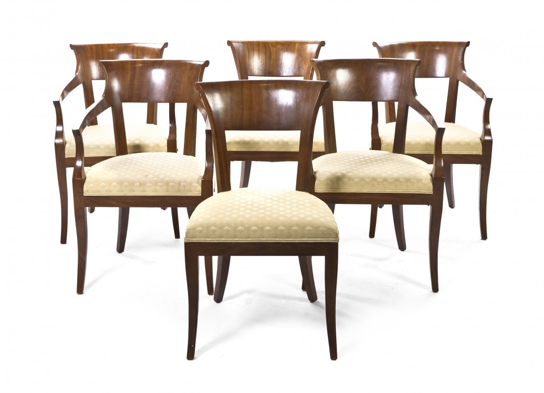 A Set of Six Biedermeier Dining Chairs, Height 32 : A Set of Six Biedermeier Dining Chairs, comprising four armchairs and two side chairs, each with a flared crest rail over the upholstered trapezoidal seats, raised on slightly splayed legs. Height 32 