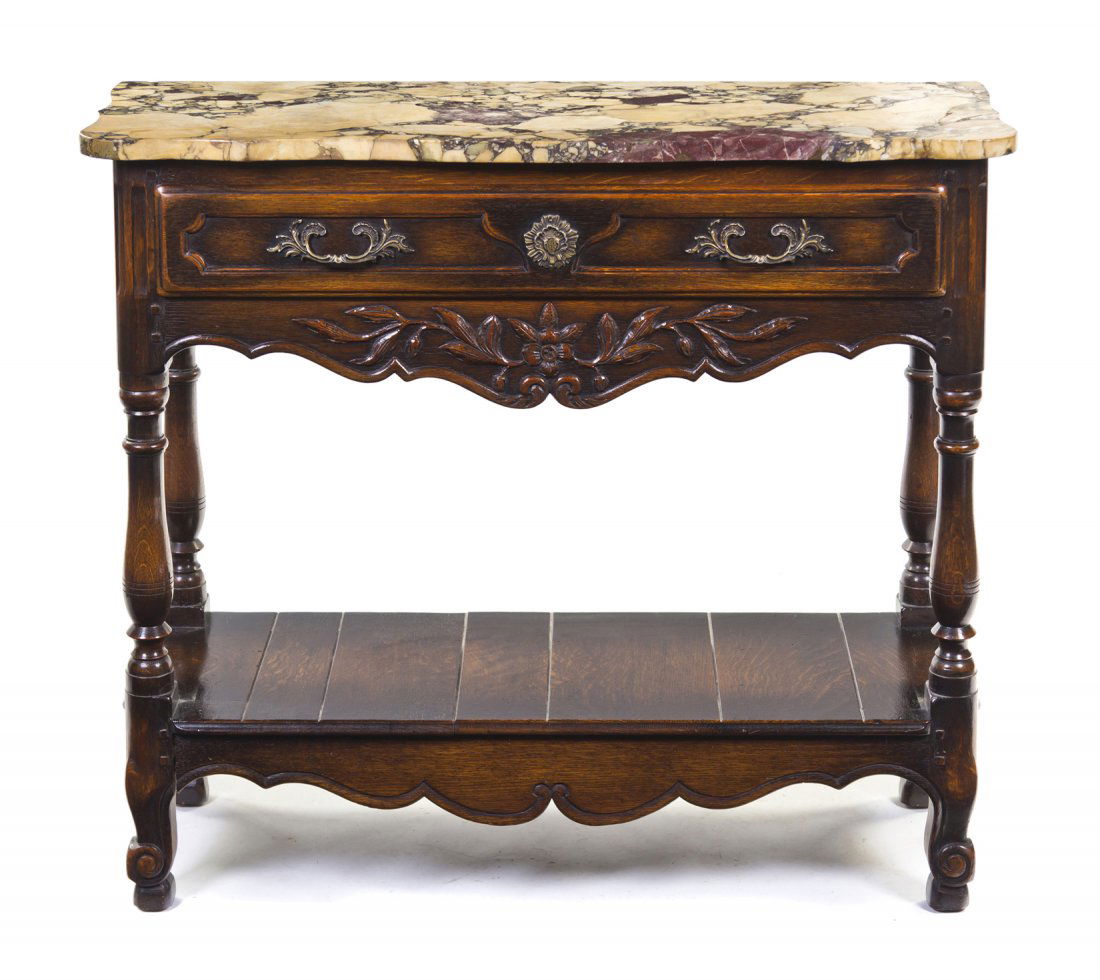 A Continental Oak Dessert Table, Height 35 1/4 x w: A Continental Oak Dessert Table, having a rectangular marble top over a single drawer above a shaped apron, raised on turned legs joined by a medial shelf. Height 35 1/4 x width 40 1/2 x depth 15 1/2