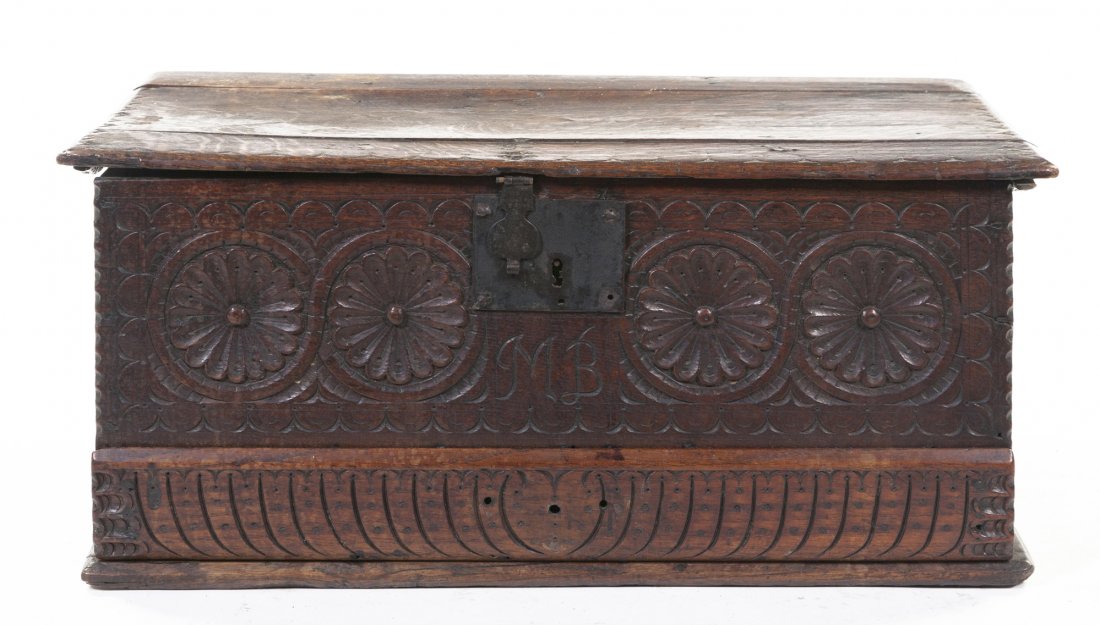A Continental Oak Chest, Height 11 1/2 x width 26 : A Continental Oak Chest, of rectangular form, the frieze decorated with repeating medallions, the base set with a hidden drawer. Height 11 1/2 x width 26 1/4 x depth 14 1/4 inches. Property from the C