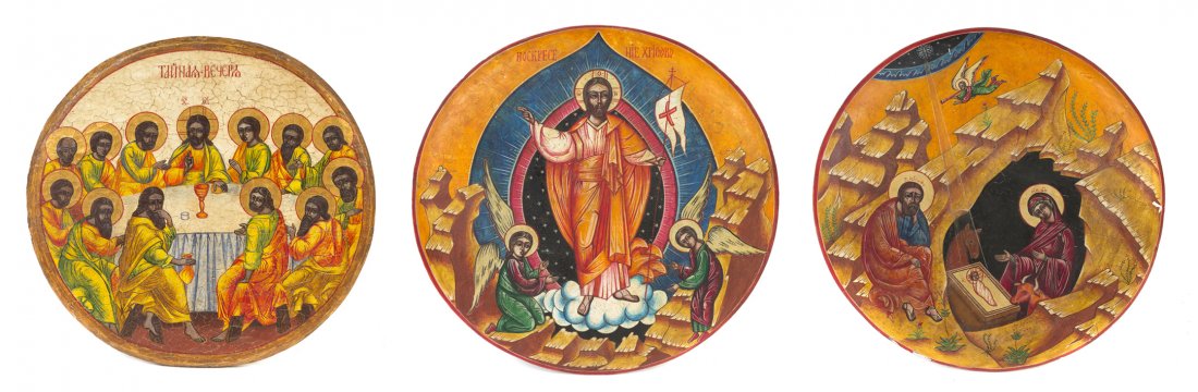 Three Eastern European Painted and Parcel Gilt Ico: Three Eastern European Painted and Parcel Gilt Icons, each of circular form decorated in the Byzantine taste, depicting the Nativity, the Last Supper and the Ascension. Diameter of largest 13 inches.