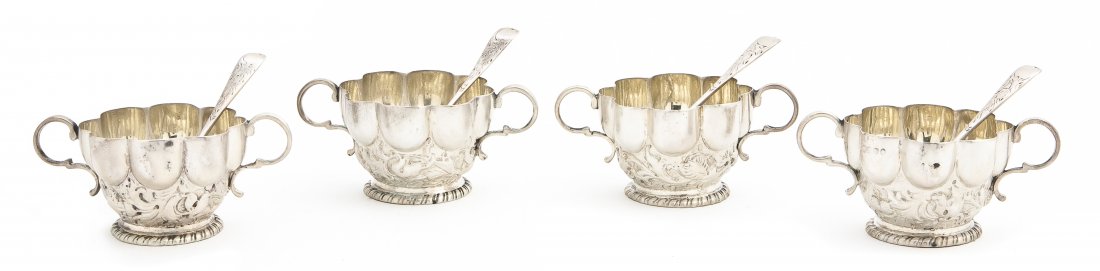 An English Silver Salt Service, James Wakely & Fra: An English Silver Salt Service, James Wakely & Frank Clarke Wheeler, London, 1888, comprising four lobed salt vessels and spoons, contained in a fitted leather case; approximate total weighable 5.16 o