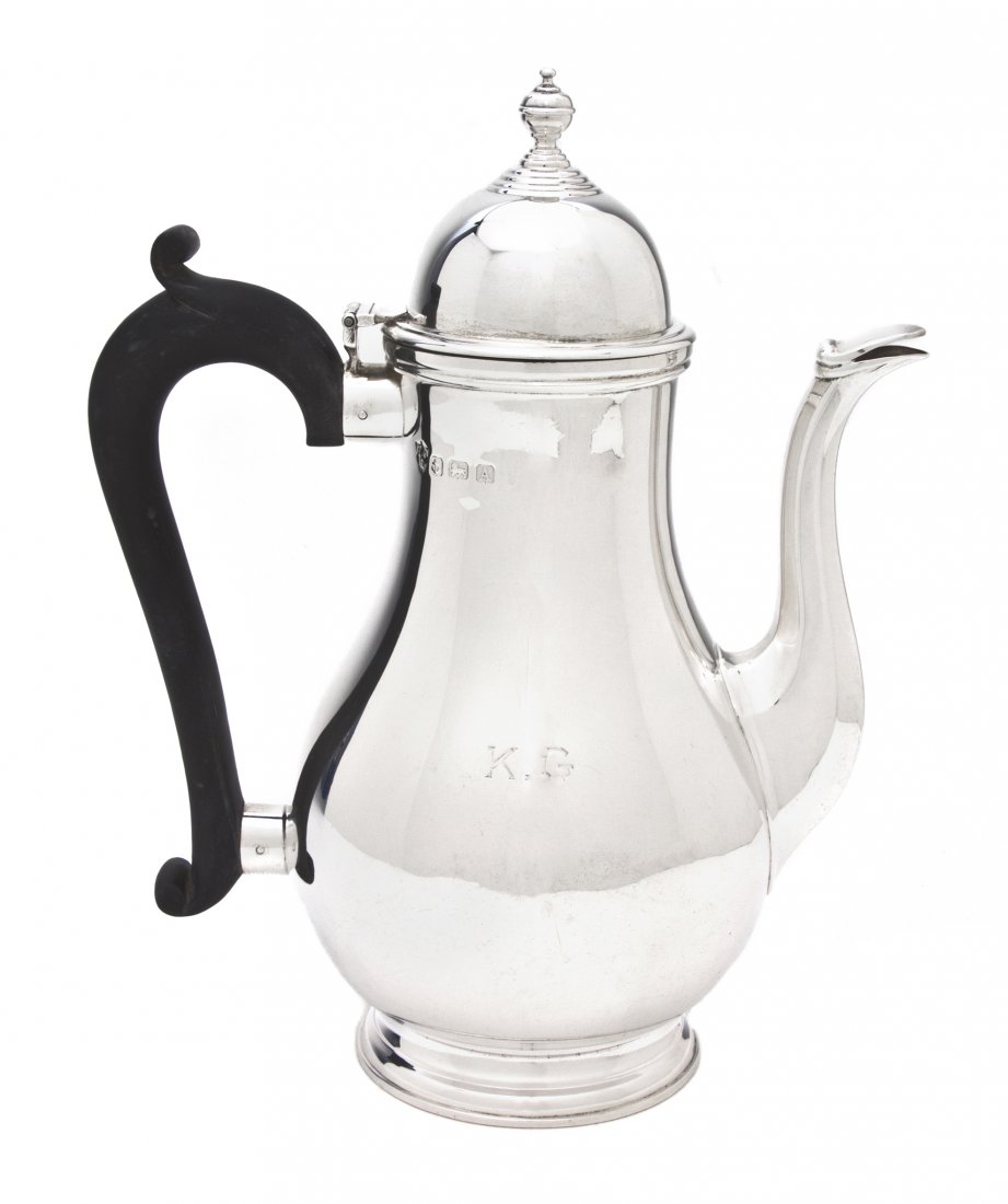 An English Silver Coffee Pot, Ellis Jacob Greenber: An English Silver Coffee Pot, Ellis Jacob Greenberg, Birmingham, 1925, of baluster form having an applied scrolling ebonized handle, raised on a circular foot, monogrammed K.G; approximate weight over