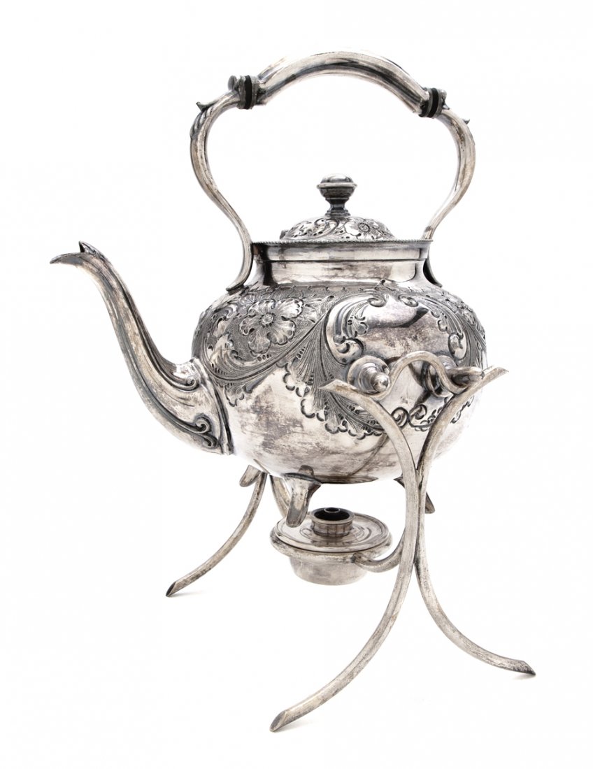 An English Silverplate Teapot on Stand, Height of : An English Silverplate Teapot on Stand, maker's mark of D.S. & Co, together with an Elkington kettle lacking stand and a silverplate tray. Height of first 11 3/4 inches.