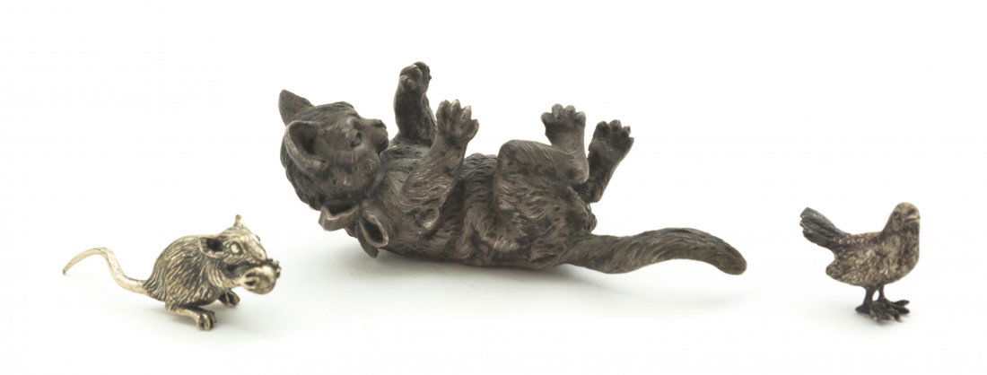 An Italian Silver Animalier Figure, Buccellati, Le: An Italian Silver Animalier Figure, Buccellati, depicting a playful kitten on its back, together with an Italian silver mouse eating a nut and a sterling silver chick. Length of longest 3 1/8 inches.