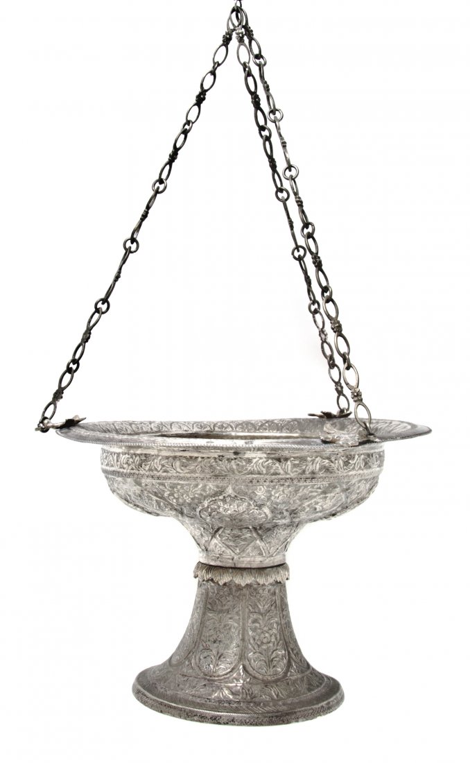 A Middle Eastern Silver Lantern, Diameter 9 inches: A Middle Eastern Silver Lantern, of compote form, with foliate and geometric repousse decoration, suspended by chains. Diameter 9 inches.