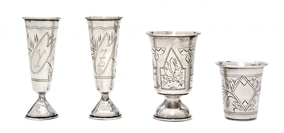 Three Russian Silver Cordials, Height of tallest 3: Three Russian Silver Cordials, two marked Kiev, with second Kokoshnik mark, of fluted tapering form having engraved leaf decoration and an associated example marked St. Petersburg with Otto Petlelius 