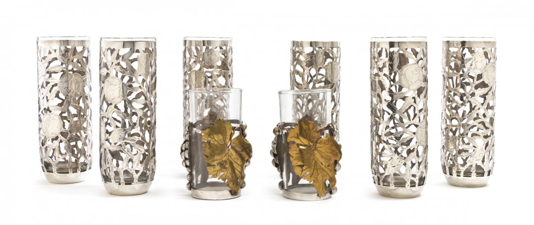 A Set of Six Mexican Sterling Silver Overlay Iced: A Set of Six Mexican Sterling Silver Overlay Iced Tea Glasses, each of cylindrical form with tapering bottoms having floral decoration throughout, together with two tumblers with grapevine decoration 
