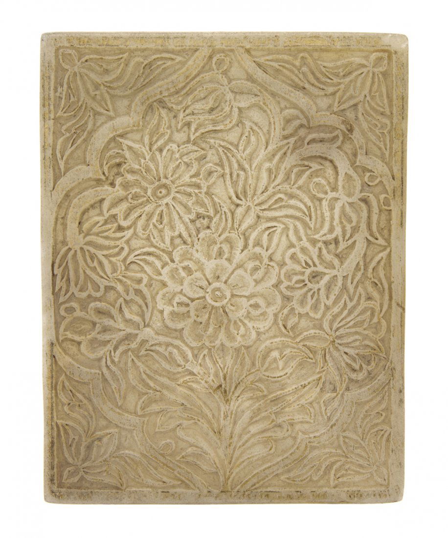 An Eastern Carved Alabaster Tile, Height 7 1/2 x: An Eastern Carved Alabaster Tile, of rectangular form, depicting flowers within a shaped lozenge, having some remnants of gilt highlights throughout. Height 7 1/2 x width 5 3/4 inches.