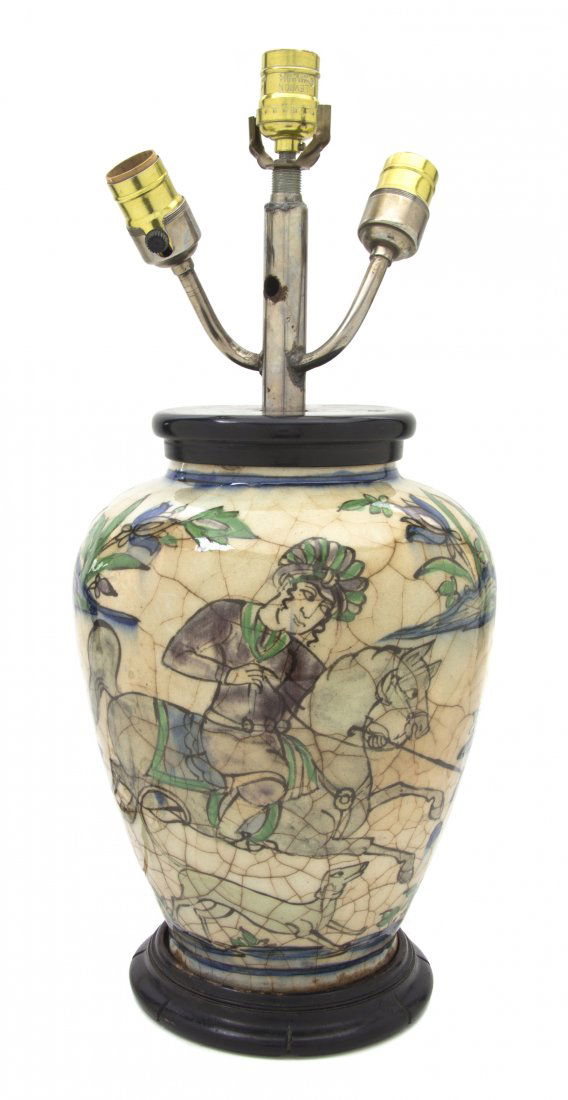 A Middle Eastern Style Faience Vase, Height 21 in: A Middle Eastern Style Faience Vase, of baluster form decorated with figures on horseback, mounted as a lamp. Height 21 inches. Property from the Estate of Helen and C. Nicholas Johnson, Jr., Cave Cre