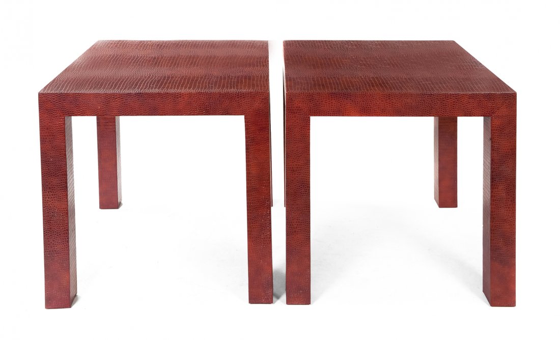 A Pair of Lizard Embossed Leather Parson's Tables: A Pair of Lizard Embossed Leather Parson's Tables, in the manner of Karl Springer, each having a square top raised on square legs, the whole wrapped in red leather. Height 27 1/2 x width 28 x depth 28